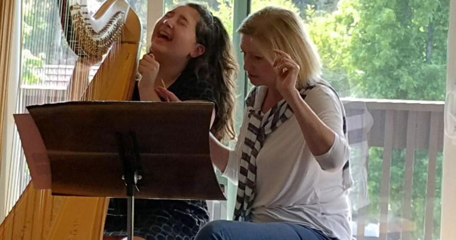 Elena Mashkovsteva and Her Student Engrossed in a Lesson - K&M Music School Harp Lessons for Kids and Adults in San Diego