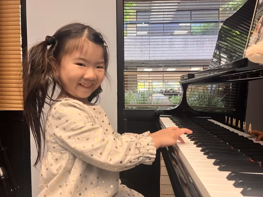 young student practicing piano at K&M Music School