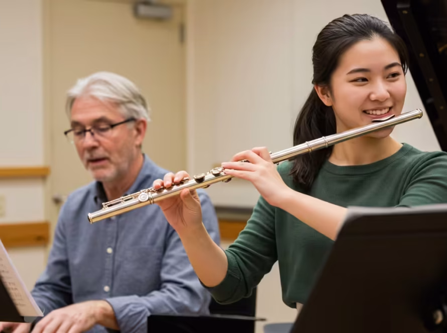 A student and teacher perform a duet, developing the essential life skill of collaboration through musical performance