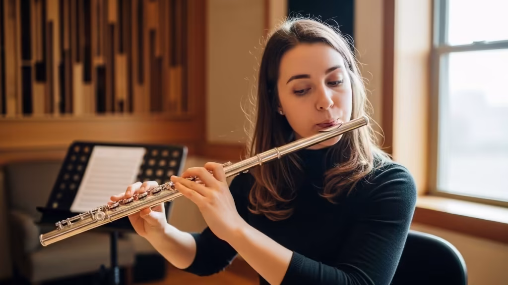 Adult practicing flute in a quiet lesson studio