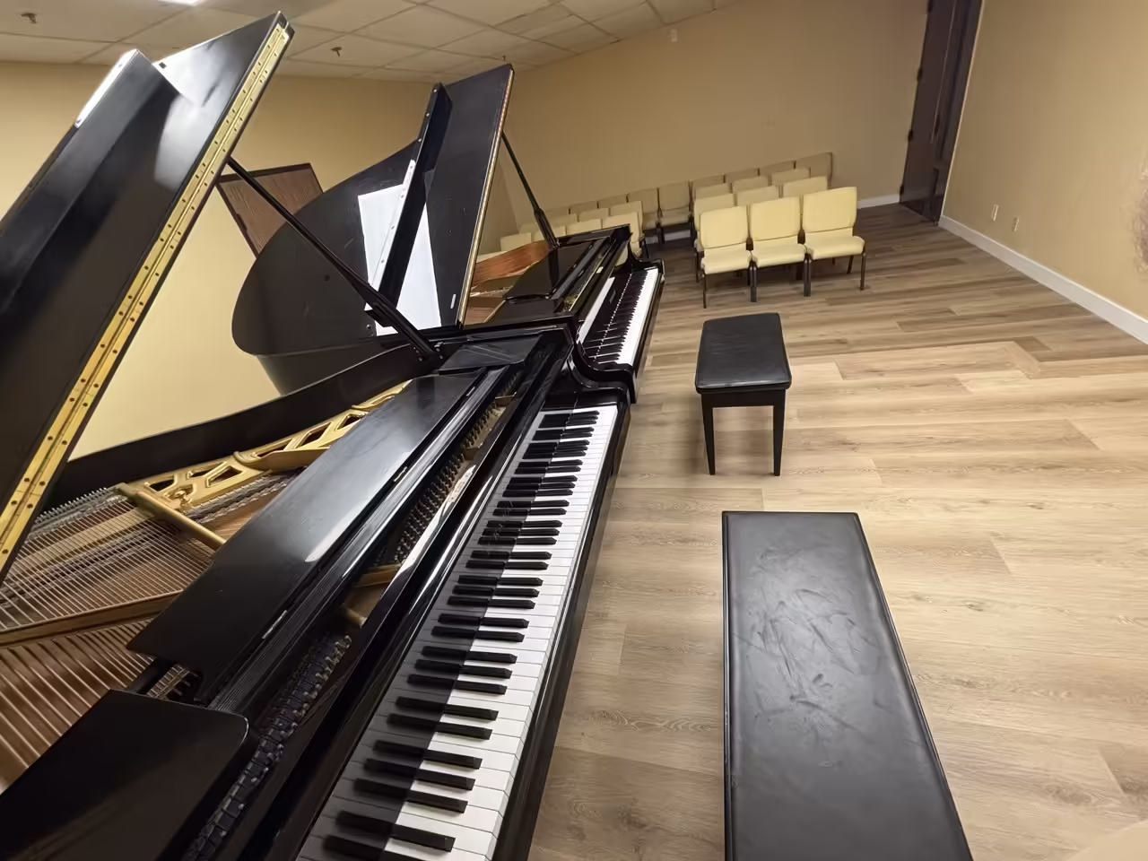 K&M Music School Recital Hall with two grand pianos on stage