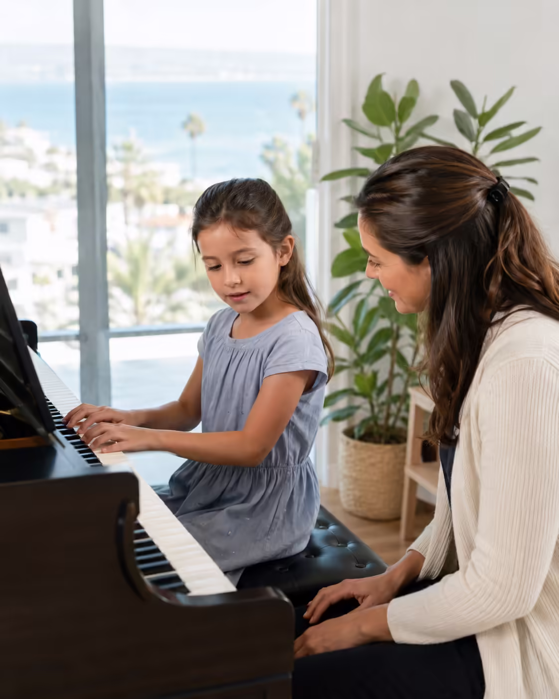 Child taking a piano lesson at a San Diego studio