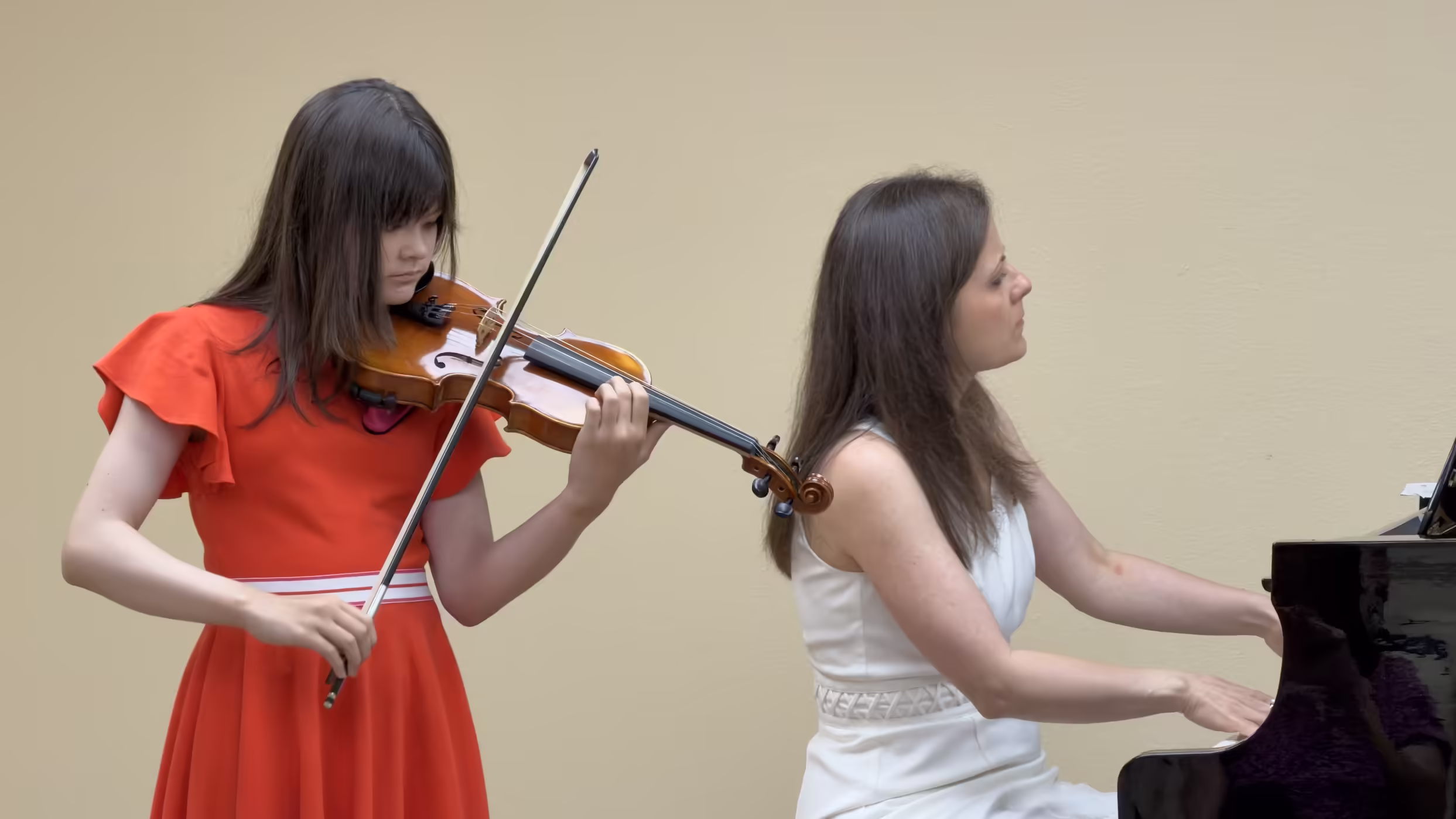 Violin student performing with piano accompaniment in San Diego